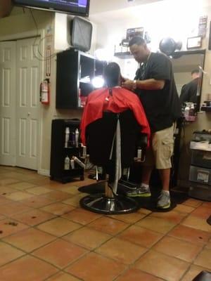 Ty getting his hair cut by Pepe. He does a great jog