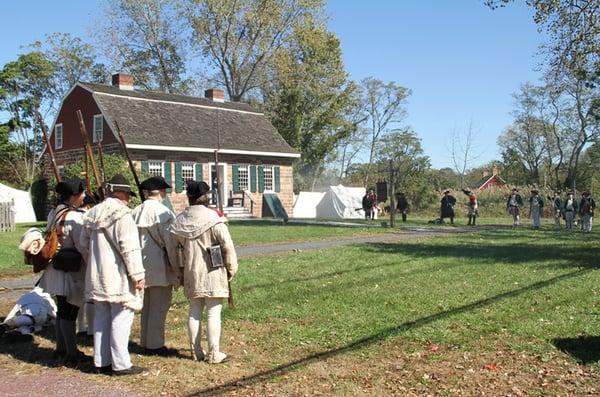 The Campbell-Christie House at Historic New Bridge Landing with reenactors at an event.