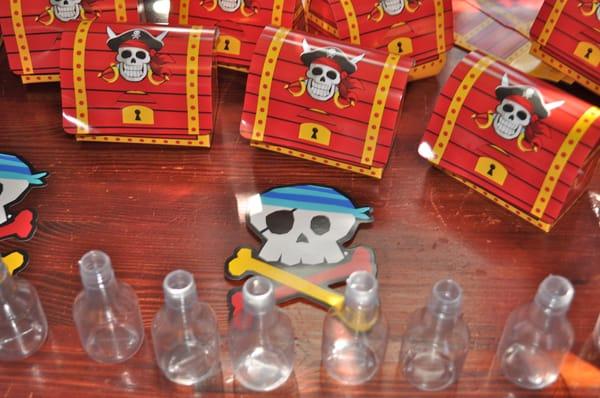 Pirate treasure boxes and messages in a bottle they made