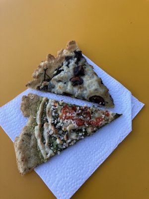 Slices of pizza (mushroom with Daiya cheese and pesto with cashew cheese).