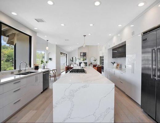 Gloss white custom cabinets manufactured & installed by Sako & his brothers