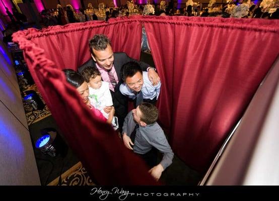 Our Quick Photo Booth comfortably fits 4-6 people.  And we always say the more the merrier!