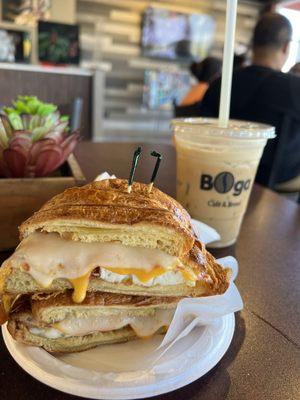 Croissant egg cheese bacon sando and iced white mocha