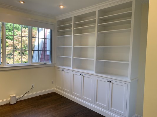 Built-in bookshelves, built to my specs. All shelves adjustable, including inside the cabinets