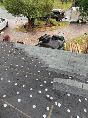 In progress of laying 3-tab shingles on a pompano beach re-roof