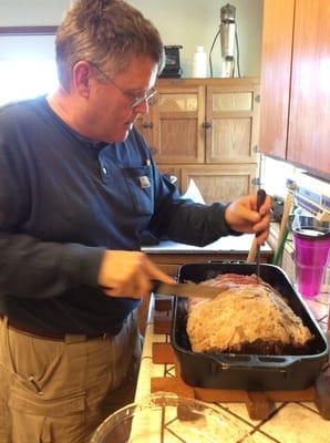 My husband serving up Christmas dinner in my biggest fryer.