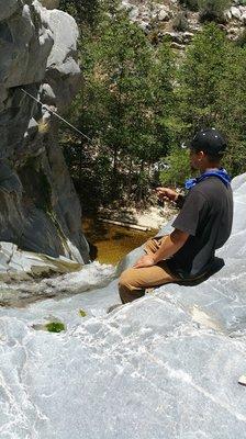 Fishing over the waterfall.