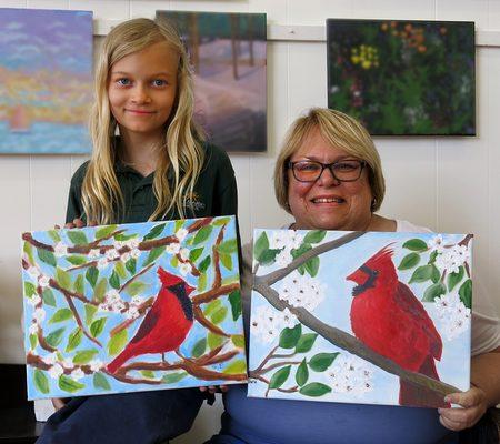 Student Sydney and her grandmother Wendy create art together in Miss Jo's Oil Painting class.