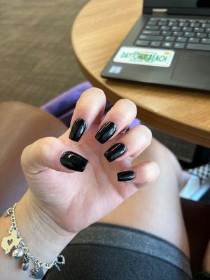 all black dip nails with rounded square shape on all natural nail