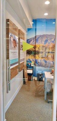 Sales center graphics including a wall mural, printed frame inserts and glass door graphics.