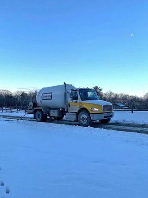 Propane truck making delivery.