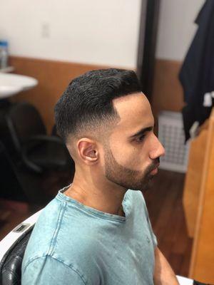 Light mid fade with a beard trim and a line up