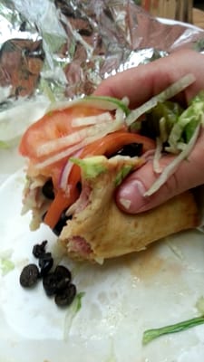 I have had many Italian combo sandwiches in grinder rolls but never in a pita. It was awesome.