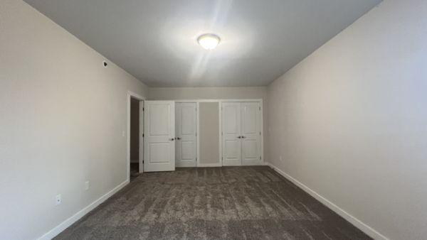 Very large bedroom with walk in closets at Cinema Apartments.