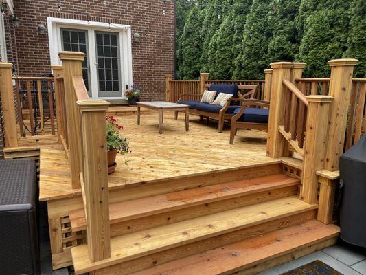 Deck refurbishment.  Old deck with new decking with natural stain.