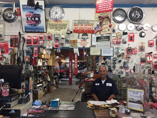 Bo with the front of his shop in the background. A ton of rare parts here. A great shop all around.