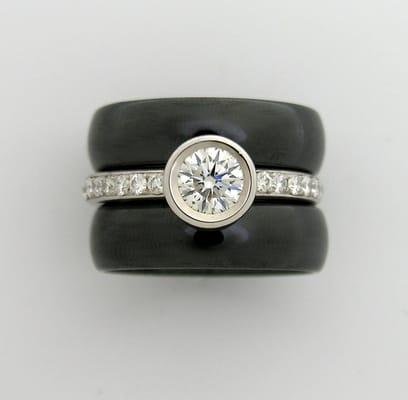 Platinum and Diamond engagement ring  flanked by ceramic bands