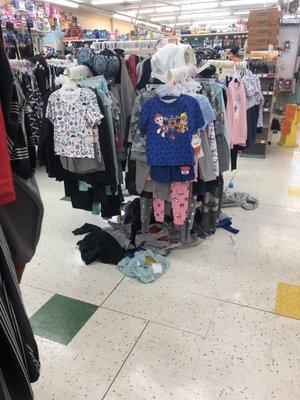 Look at all those clothes on the ground around the racks!!