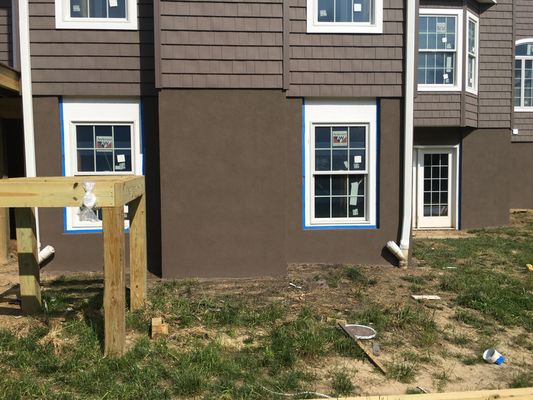 Dark brown architectural stucco to match house siding