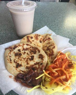 Delicious bean and loroco pupusas and a cup of horchata at Lela's Bakery.