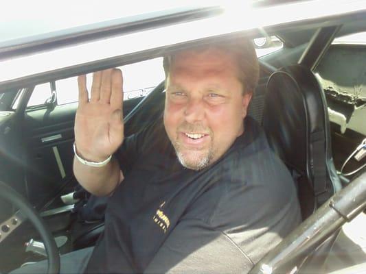 Owner Charles Lancey waving before a run down the track