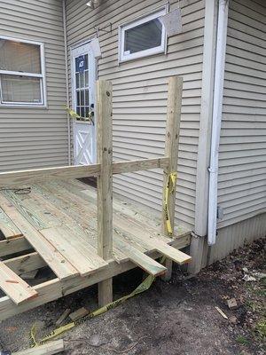 Adding a cost effective deck to an unused entrance to build potential.