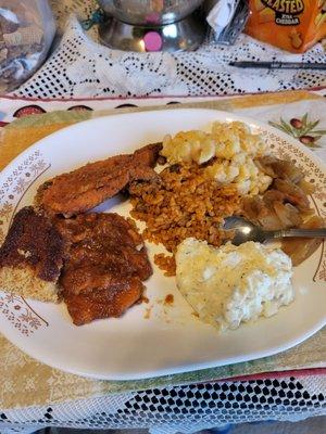 Fish, rice/beans  candy yams, mac/cheese potato salad, cabbage plus corn bread. And banana pudding