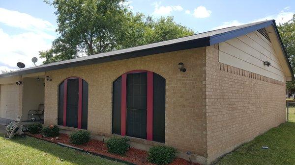 (After) Side of the house, new roof and paint.