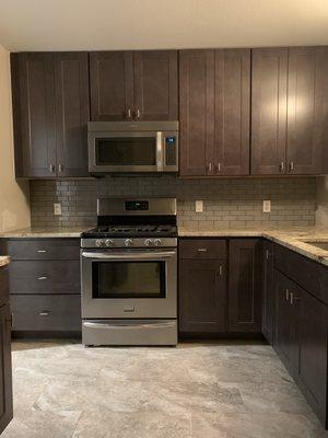 This was an outdated kitchen that was literally falling apart. New floors, new cabinetry, new countertops, new everything!