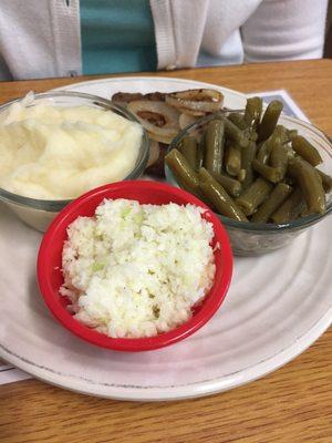 Hamburger steak, green beans, slaw and potatoes.