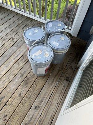 Paint buckets left on balcony to make it look like somone painted