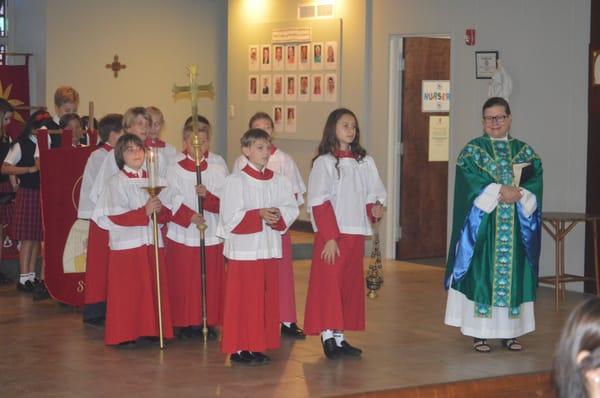 Students in Grades 1-5 attend chapel once a week with the older students serving as acolytes.