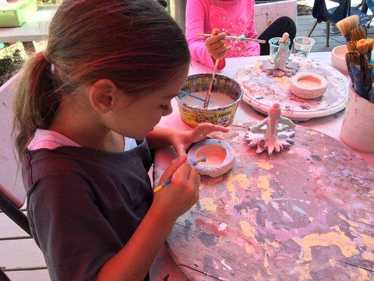 Learning to glaze pottery