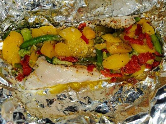 Halibut & veggies wrapped in foil. Threw this whole thing on the grill. Delicious