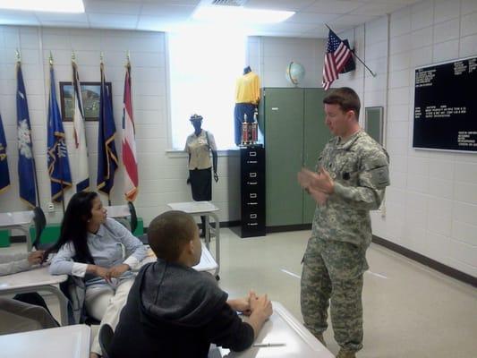 SSG Grant talks to a High School Class about the importance of education and how the Army can help them achieve their goals