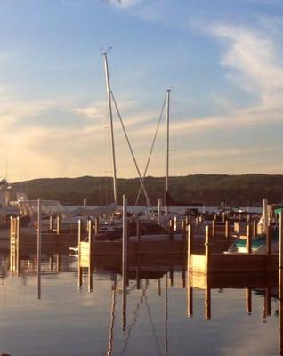 The quiet beauty of glassy water and masts...something deep in our consciousness recognizes this even if we don't sail