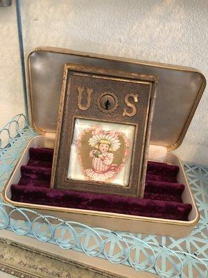 Old post office box door with vintage jewelry box stand