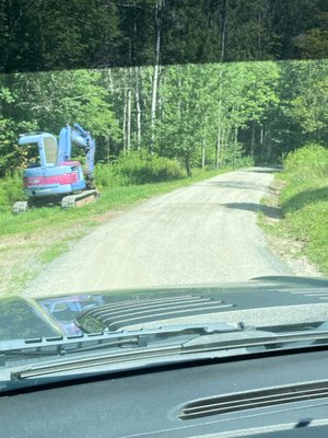 Regrade and add crusher run to driveway