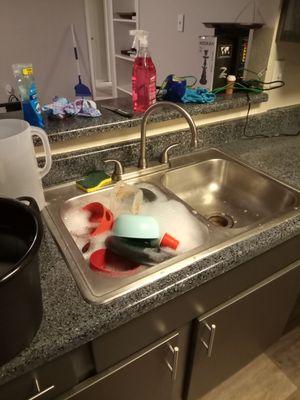 The kitchen. Dirty dishes that we washed we do the baseboards we let the dishes dry and then put them up cleaned off the counters