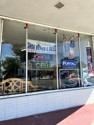 Front of the shoe repair shop.