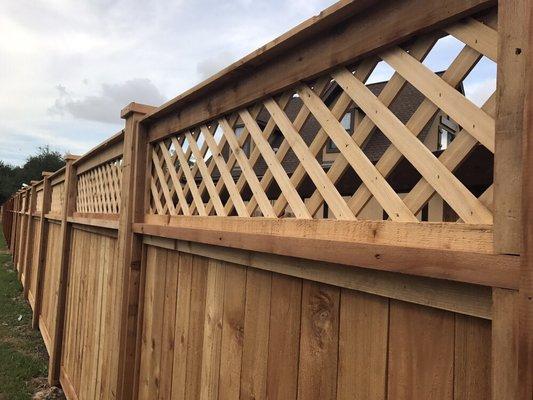 Cedar fence installation.