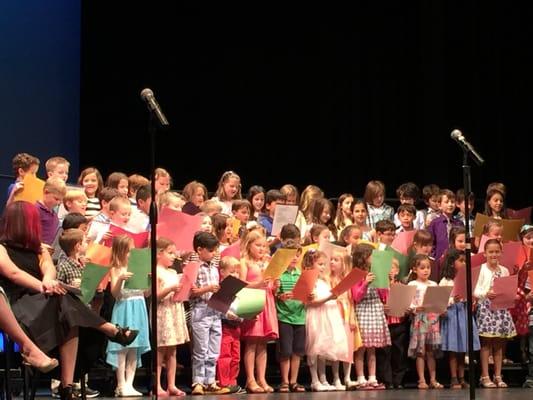 Classes proudly perform musical pieces for parent audience at our annual Winter Showcase.