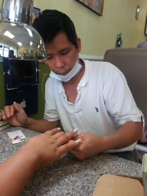 Our nail tech Anthony.