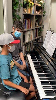 Our AGMC super student learning about the Blues on the piano