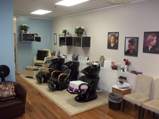 This is the Wash Station Area .We our stylist provide a deluxe hair wash /rinsing w/scalp massage. Comfortable sinks with swivel