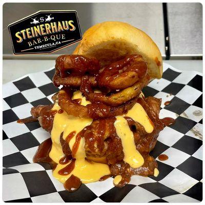 Sloppy Steiner     Tri Tip piled high with beer cheese, tangy sauce, and onion rings.