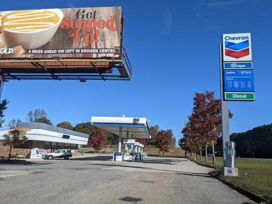 Outside. View of the gas station and convenience store from the south, looking north. Georgia 400 to my right.