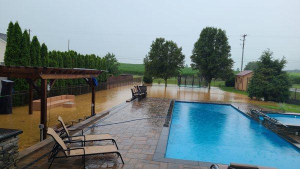 His 'new' drainage system that helped back fill our yard.. there are patios fully submerged to the left side.