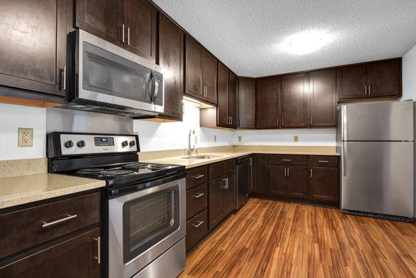 Kitchen with upgraded cabinets and stainless steel appliances.