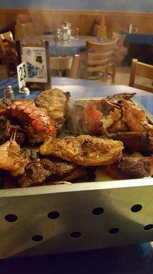 Ordered the parilla.. so much food.. 3 kinds of shrimp, lobster, steak, chorizo, fish, onions, peppers.... at a great price. Delicious.